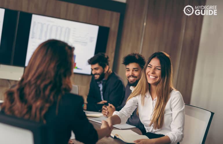 Human Resources Manager talking to company's employees