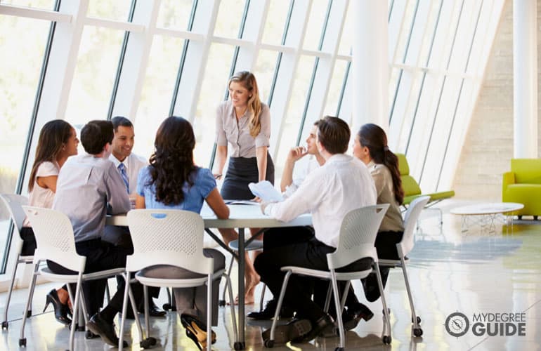 office manager talking to her team in a modern office