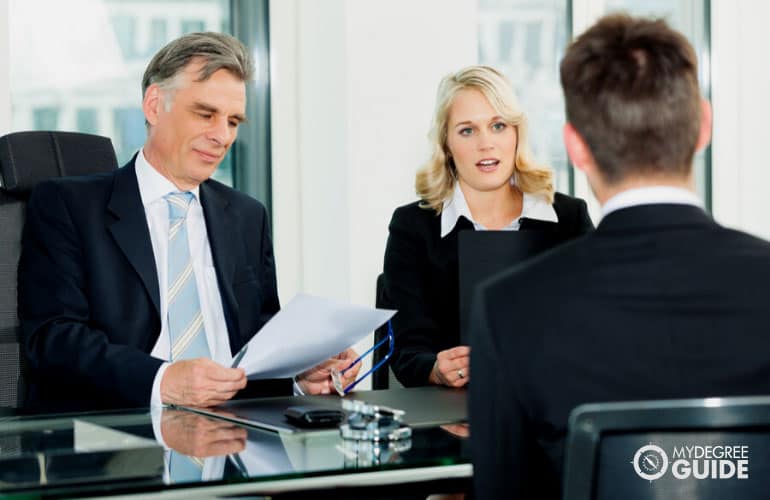 human resource managers interviewing a job applicant