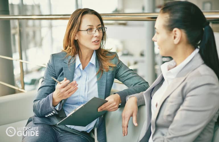 human resource person talking to a female employee