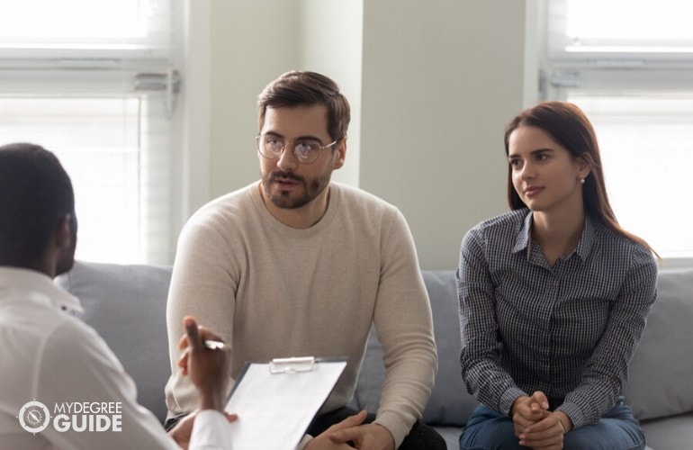 marriage counselor talking to a couple