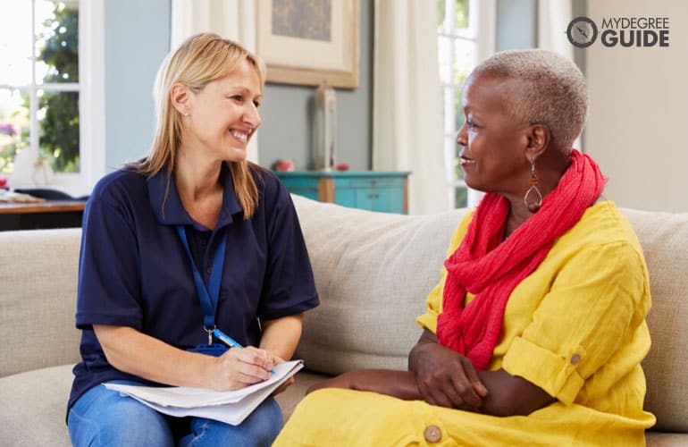 human services worker talking with a senior woman