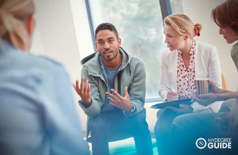 human services counselor having a group counseling 