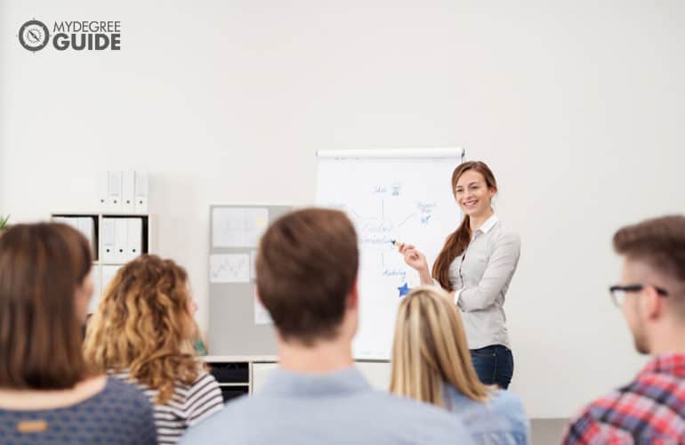 community leader discussing during a meeting in an office