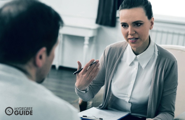 Social worker interviewing a man