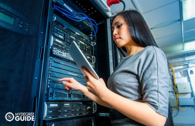 IT manager checking the computer system in data room