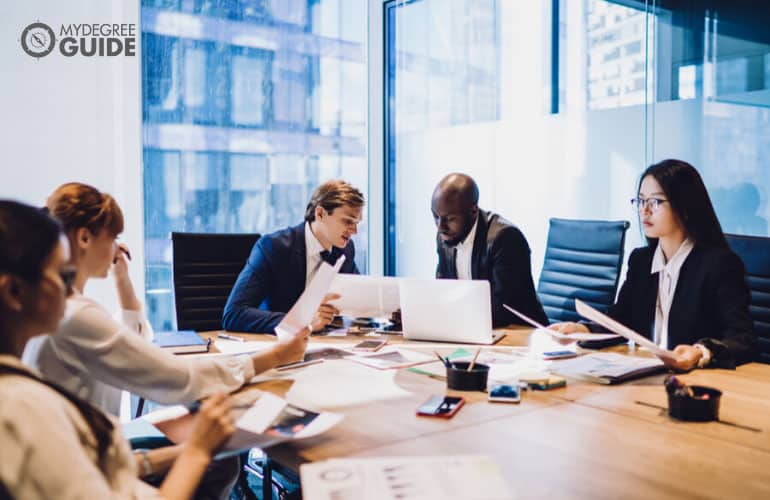 multi-ethnic financial analysts in a meeting