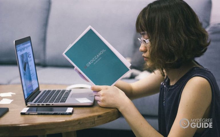 international student with laptop at desk