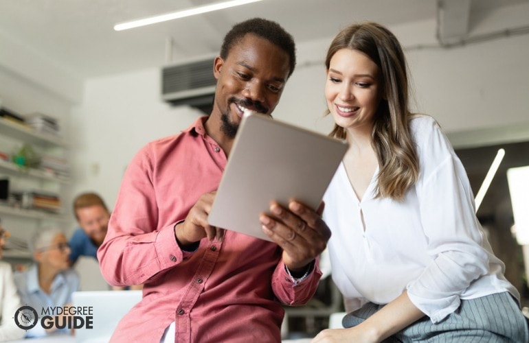 Information security analysts working on a project together