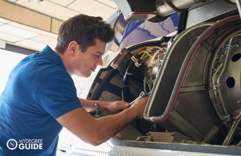 Mechanical Engineer working on an aircraft