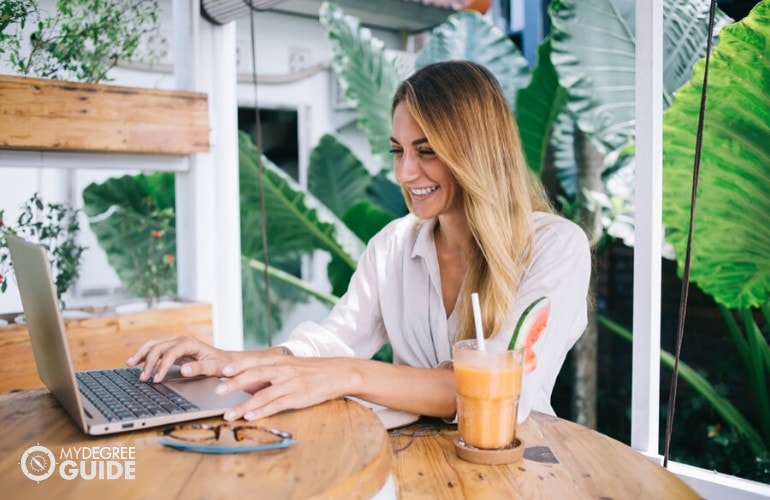 Doctorate in Public Administration student studying at a cafe