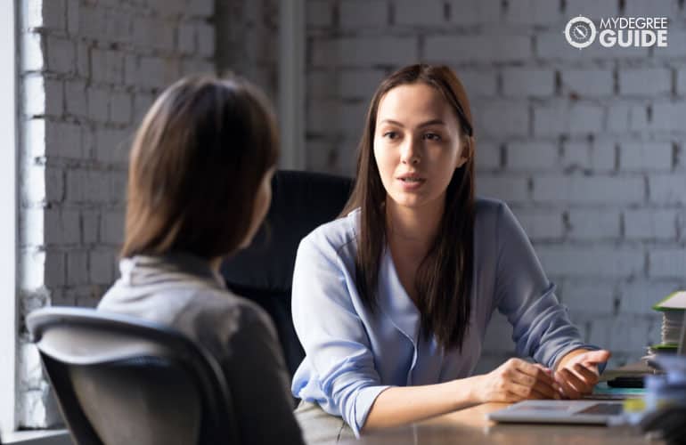 human resource manager talking to a company employee