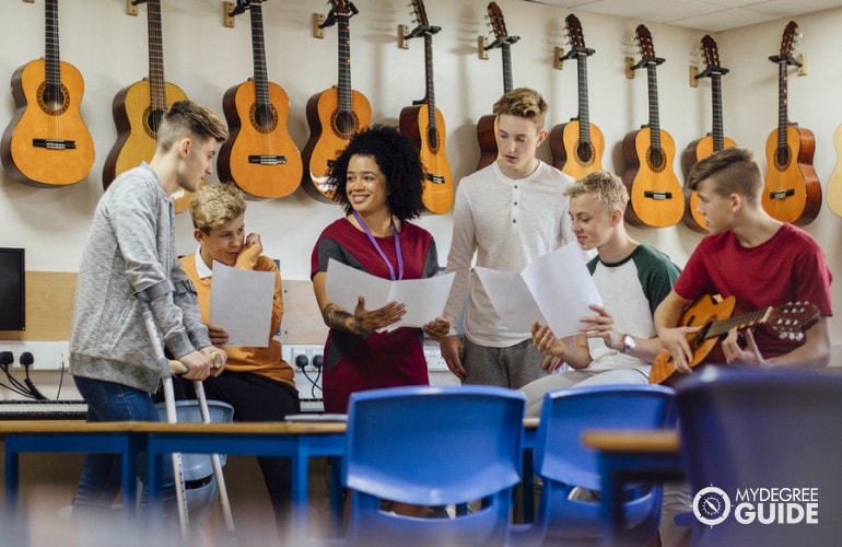 Music Teacher teaching students during Music class