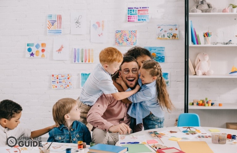 early childhood education teacher happily teaching her students