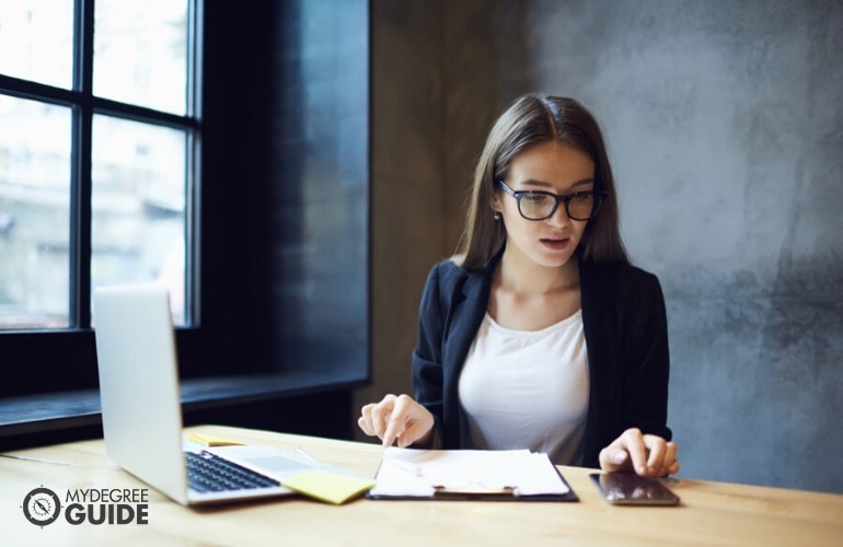 public relations manager working in her office