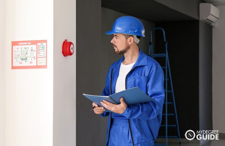 Fire Inspector checking fire measures in a facility 