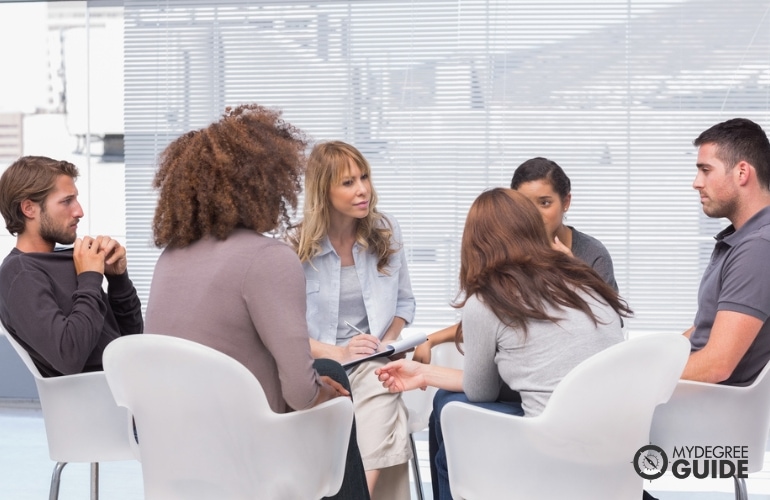 I-O Psychologist counseling a group of employees