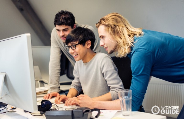 Computer Engineers working together on a project 