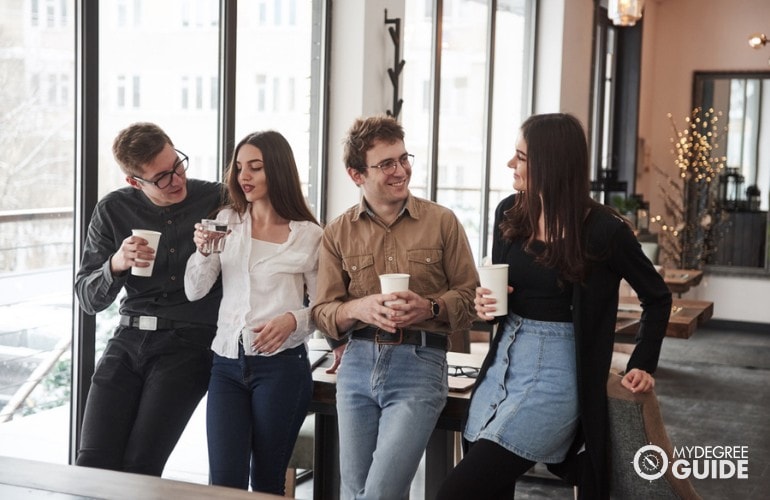 Cyber Security Analysts drinking coffee together