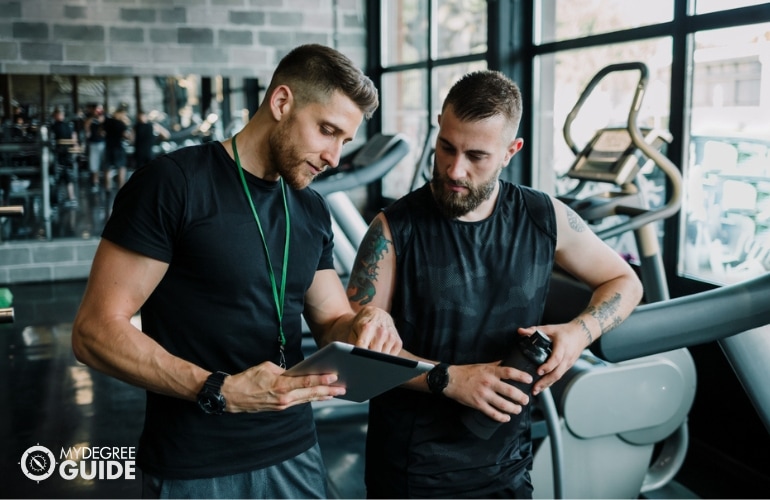 Athletic Trainer providing feedback to his client