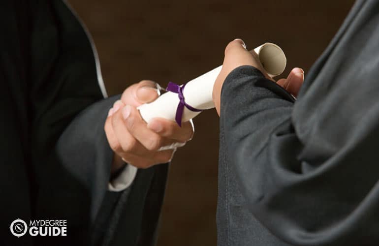 financial degree student receiving a diploma during graduation