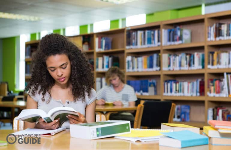 master's degree student studying in university library