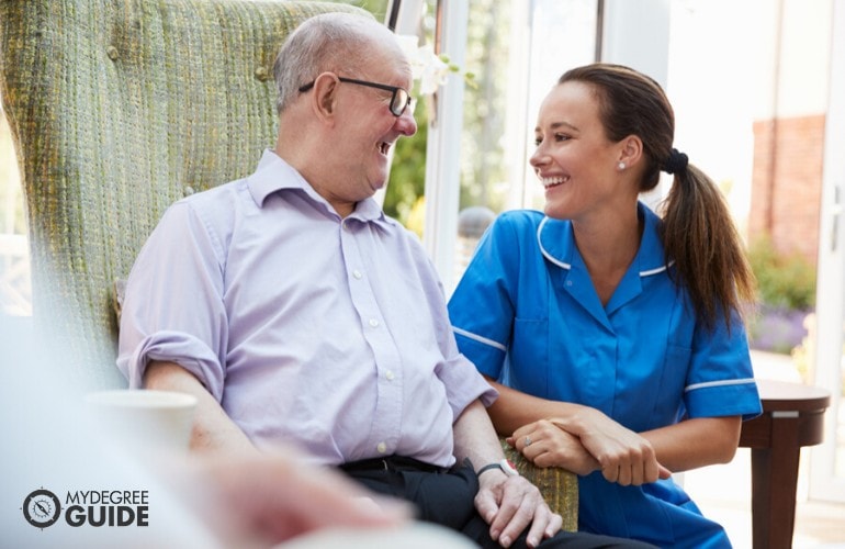 nurse taking care of an elderly man