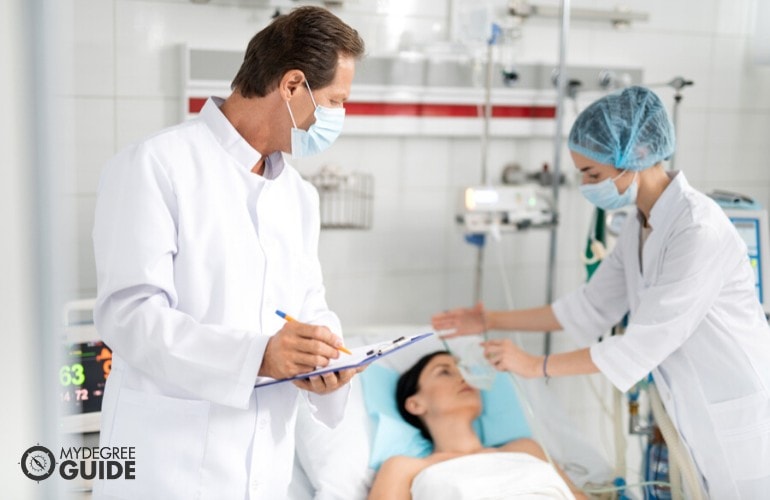 Respiratory Therapists checking on a patient