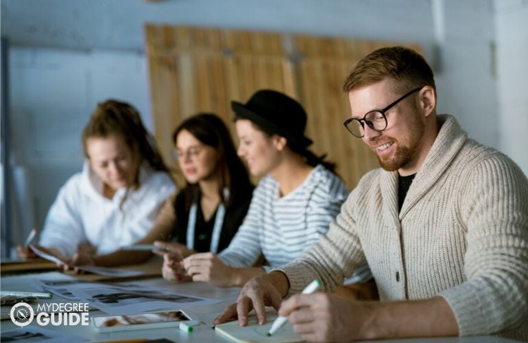 Technical Writers working in their office