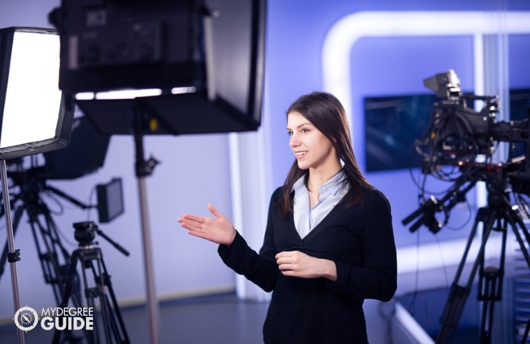 News Analyst working in a studio