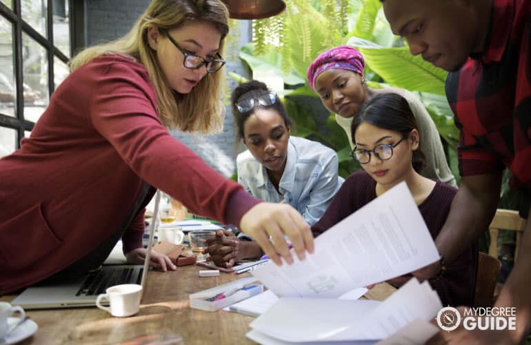 students checking a learning portfolio