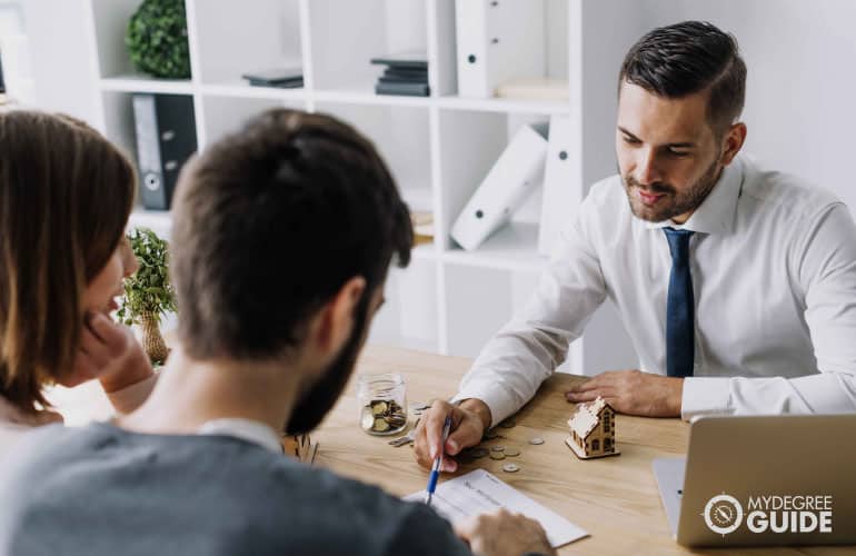 real estate agent talking to a couple