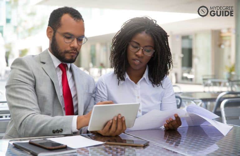 Attorney speaking with legal assistant