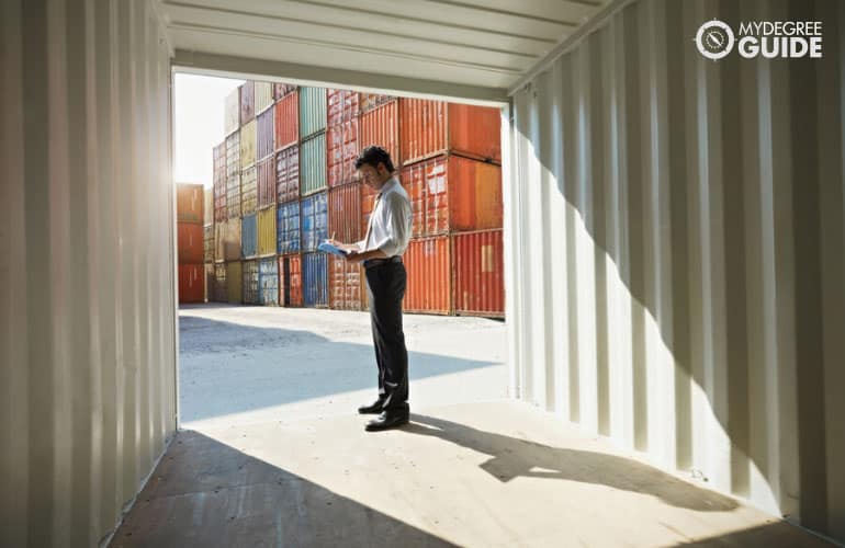 transportation supervisor checking the containers