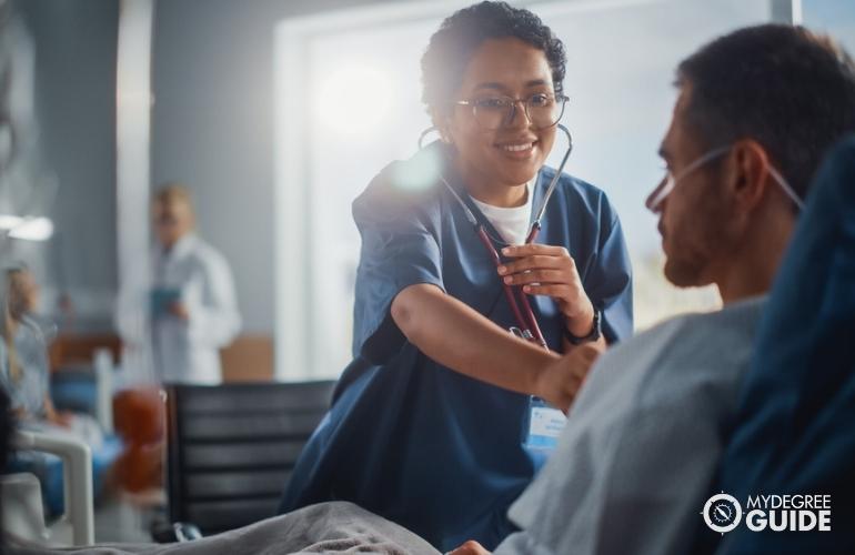 nurse checking a patient's vital signs