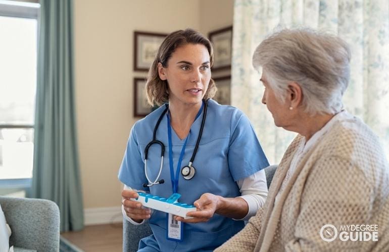 nurse visiting an elderly in her home