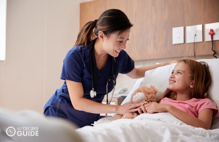 nurse checking a young patient