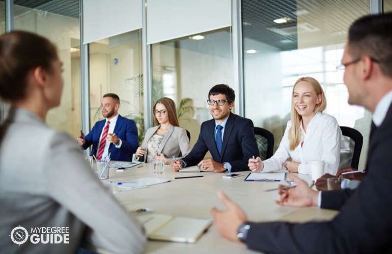 group of managers meeting in a modern office