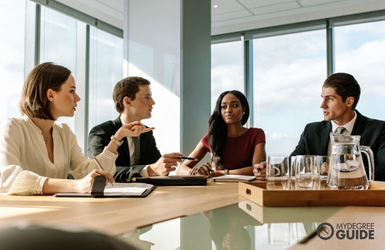 management consultants meeting in conference room