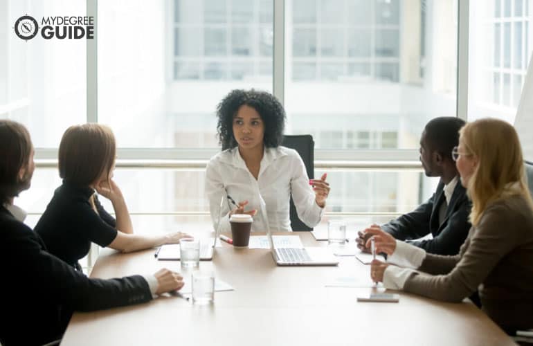 office manager having a meeting with her team