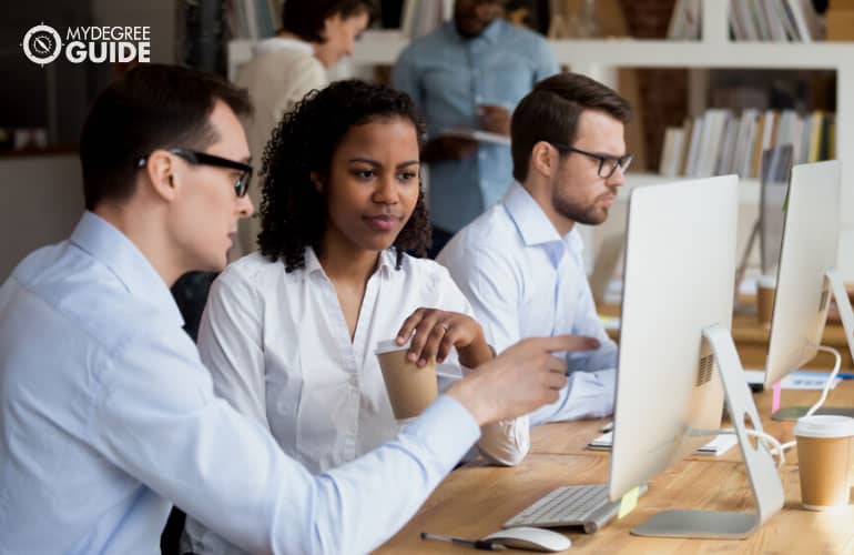 office manager mentoring an employee