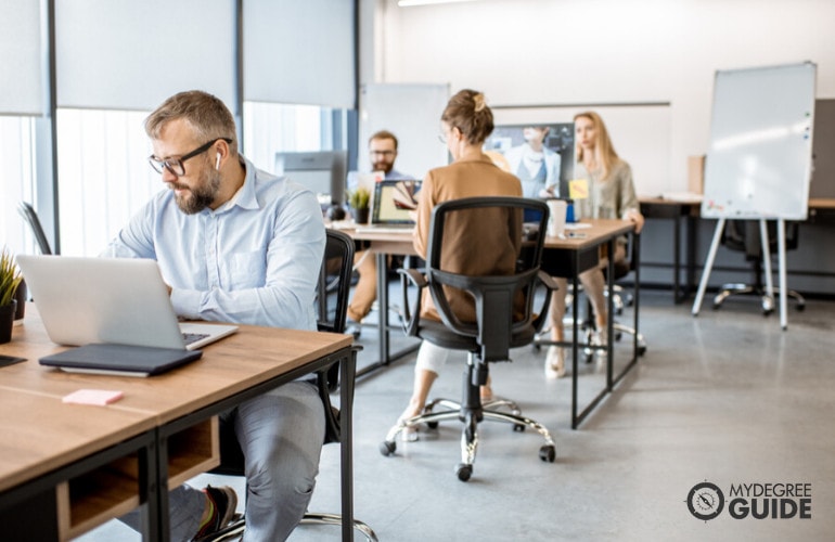 Computer Network Architects working in an office