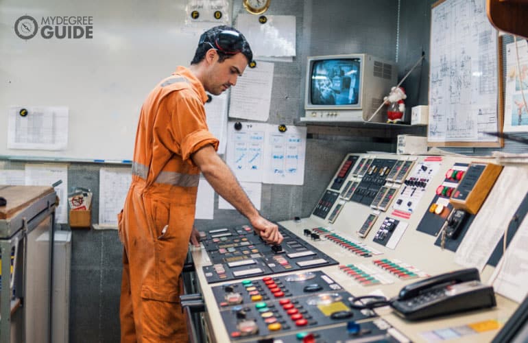 Marine Engineer working in engine control room