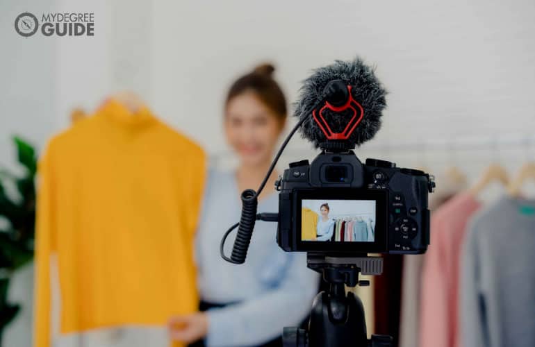 woman taking a video of her products