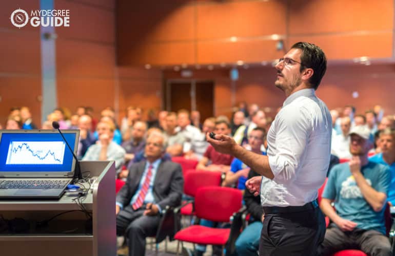 male speaker talking to a crowd