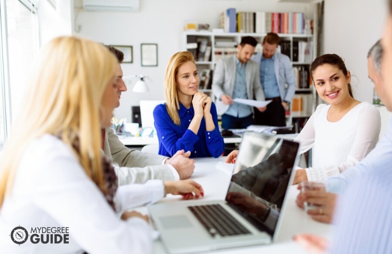 Market research manager planning with her team