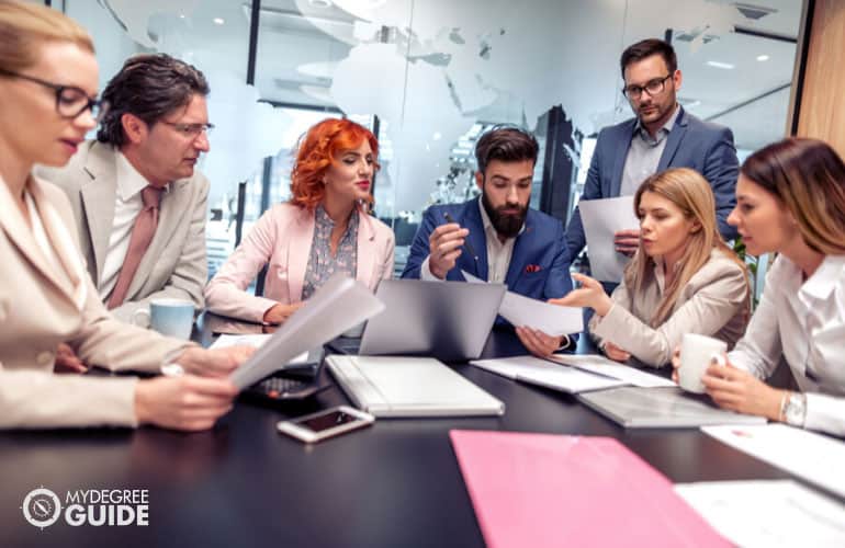 Marketing Manager working with his team in the office