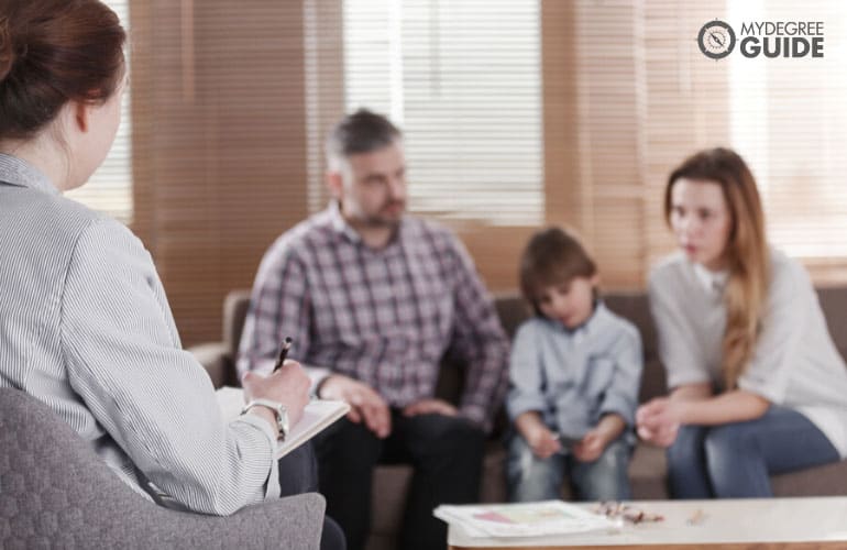 female counselor talking to a family