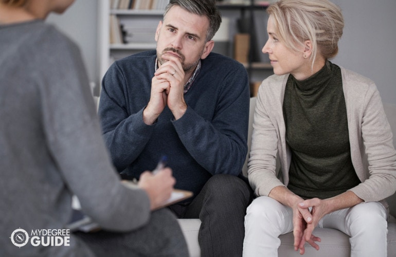 wife supporting his husband during a therapy session