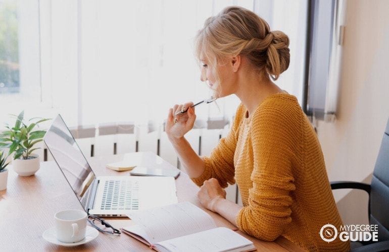 Woman getting Masters Degree in Biology online